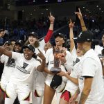 
              The Las Vegas Aces celebrate with the Commissioner's Cup after defeating the Chicago Sky 93-83 in the WNBA Commissioner's Cup basketball game Tuesday, July 26, 2022, in Chicago. (AP Photo/Charles Rex Arbogast)
            