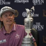 
              Cameron Smith, of Australia, with the claret jug trophy, speaks during a press conference after winning the British Open golf championship on the Old Course at St. Andrews, Scotland, Sunday July 17, 2022. (AP Photo/Alastair Grant)
            