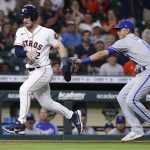 
              Houston Astros' Alex Bregman is caught in a rundown between third base and home plate by Kansas City Royals shortstop Nicky Lopez during the fourth inning of a baseball game Wednesday, July 6, 2022, in Houston. (AP Photo/Kevin M. Cox)
            