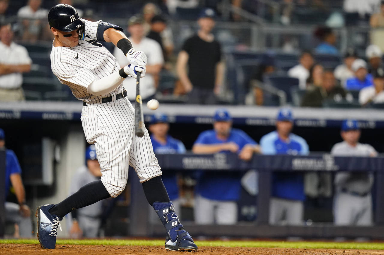 New York Yankees' Aaron Judge hits a grand slam during the eighth inning of a baseball game against...