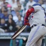 
              Toronto Blue Jays' Vladimir Guerrero Jr. breaks his bat as he grounds out during the first inning of the team's baseball game against the Seattle Mariners, Friday, July 8, 2022, in Seattle. (AP Photo/Ted S. Warren)
            