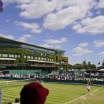 
              Spectators watch as Italy's Georgia Pedone serves during a Girls singles match on day eight of the Wimbledon tennis championships in London, Monday, July 4, 2022. (AP Photo/Alberto Pezzali)
            