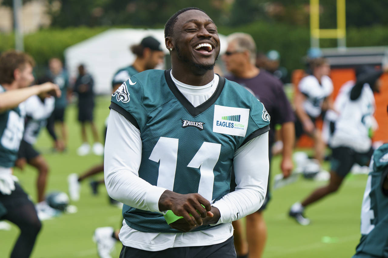 Philadelphia Eagles' A.J. Brown laughs during practice at the NFL football team's training camp, We...