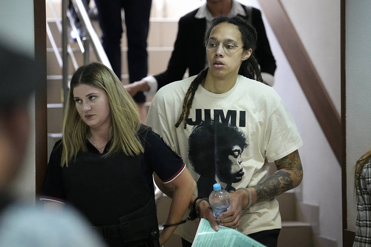 WNBA star and two-time Olympic gold medalist Brittney Griner is escorted to a courtroom for a heari...