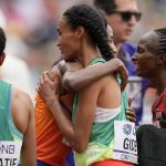 
              Letesenbet Gidey, of Ethiopia, gets a hug from Sifan Hassan, of the Netherlands, after winning the women's 10000-meter run final at the World Athletics Championships on Saturday, July 16, 2022, in Eugene, Ore. (AP Photo/Ashley Landis)
            