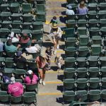 
              Fans attend the first baseball game of a doubleheader between the Oakland Athletics and the Detroit Tigers in Oakland, Calif., Thursday, July 21, 2022. (AP Photo/Godofredo A. Vásquez)
            