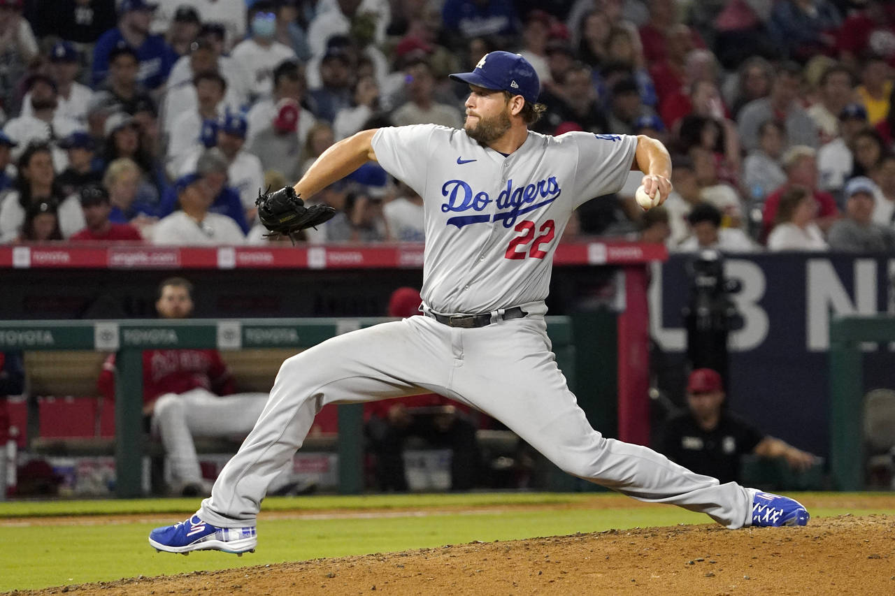Los Angeles Dodgers starting pitcher Clayton Kershaw throws to the plate during the seventh inning ...