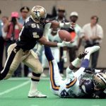 
              FILE - New Orleans Saints' Sam Mills grabs a fumble during the team's NFL football game against the Minnesota Vikings on Sept. 22, 1991, in New Orleans. Mills played Division III college football and was not drafted. That made his rise to stardom with the Saints and Carolina Panthers — and his enshrinement in the Pro Football Hall of Fame in Canton, Ohio, this weekend — all the more remarkable. (Ellis Lucia/The Times-Picayune via AP, File)
            
