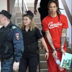 
              WNBA star and two-time Olympic gold medalist Brittney Griner is escorted to a courtroom for a hearing, in Khimki just outside Moscow, Russia, Thursday, July 7, 2022. Jailed American basketball star Brittney Griner returns to a Russian court on Thursday amid a growing chorus of calls for Washington to do more to secure her release nearly five months after being arrested on drug charges. (AP Photo/Alexander Zemlianichenko)
            