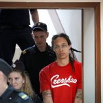 
              WNBA star and two-time Olympic gold medalist Brittney Griner is escorted to a courtroom for a hearing, in Khimki outside Moscow, Russia, Thursday, July 7, 2022. Griner on Thursday pleaded guilty to drug possession and smuggling during her trial in Moscow but said she had no intention of committing a crime, Russian news agencies reported. (AP Photo/Alexander Zemlianichenko)
            