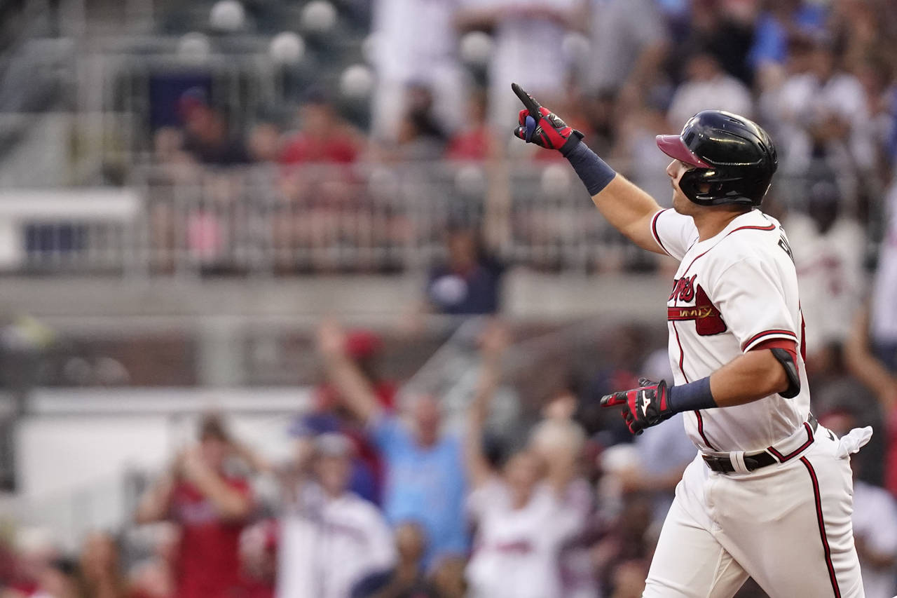 Atlanta Braves' Austin Riley celebrates after hitting a two-run home run against the St. Louis Card...