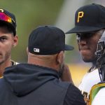 
              Pittsburgh Pirates starting pitcher Roansy Contreras, second from right, listens to pitching coach Oscar Marin during a mound visit in the second inning of the team's baseball game against the Milwaukee Brewers in Pittsburgh, Friday, July 1, 2022. (AP Photo/Gene J. Puskar)
            
