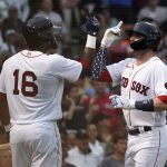 
              Boston Red Sox's Trevor Story, right, is congratulated by Franchy Cordero (16) after hitting a solo home run during the second inning of the team's baseball game against the Tampa Bay Rays at Fenway Park, Tuesday, July 5, 2022, in Boston. (AP Photo/Mary Schwalm)
            