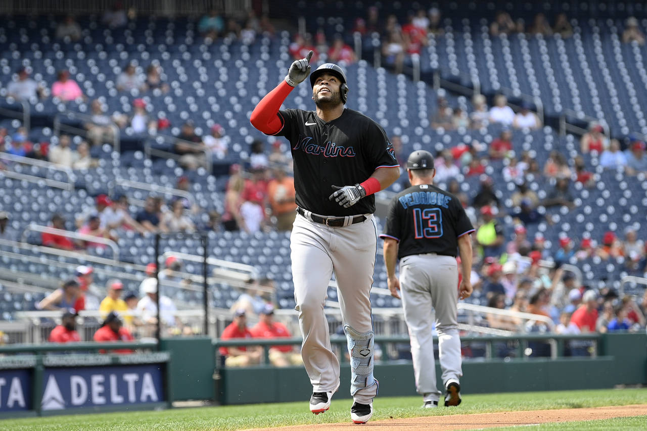 Miami Marlins' Jesus Aguilar celebrates his two-run home run during the first inning of a baseball ...