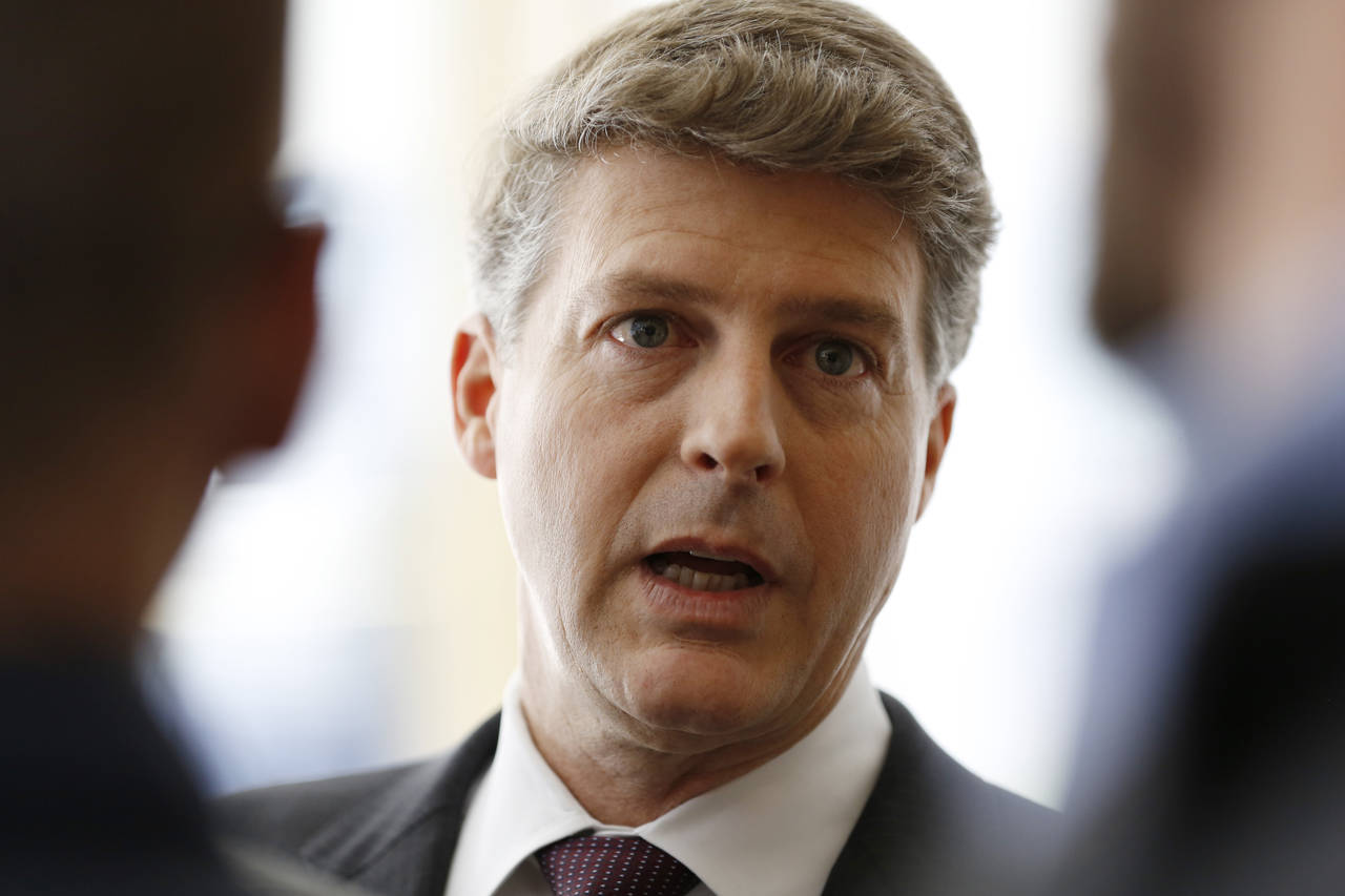 FILE - New York Yankees owner Hal Steinbrenner stops to talk to the media before attending a meetin...