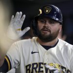 
              Milwaukee Brewers' Rowdy Tellez is congratulated in the dugout after hitting a three-run home run during the first inning of a baseball game against the Minnesota Twins Wednesday, July 27, 2022, in Milwaukee. (AP Photo/Aaron Gash)
            