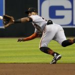 
              San Francisco Giants second baseman Thairo Estrada fields a grounder by Arizona Diamondbacks' Christian Walker, who was out at first during the sixth inning of a baseball game Wednesday, July 27, 2022, in Phoenix. (AP Photo/Rick Scuteri)
            
