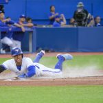 
              Toronto Blue Jays' George Springer scores against the Detroit Tigers during the third inning of a baseball game Thursday, July 28, 2022, in Toronto. (Christopher Katsarov/The Canadian Press via AP)
            