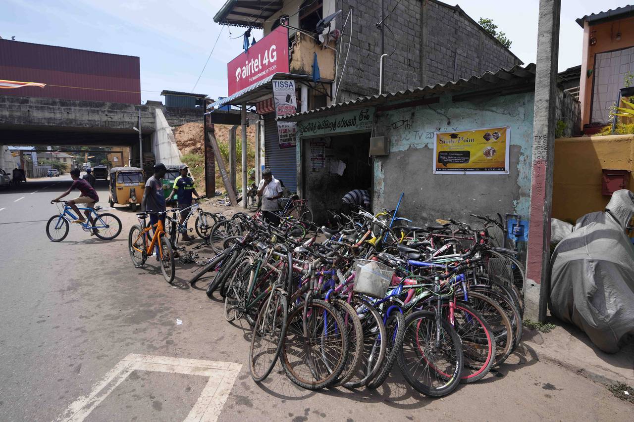 Bicycles given to be repaired are seen outside a workshop amid fuel shortage in Colombo, Sri Lanka,...