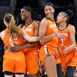 
              Team Wilson's Sylvia Fowles, second from left, celebrates with Sabrina Ionescu, left, Candace Parker, right, and A'ja Wilson after dunking against Team Stewart during the first half of a WNBA All-Star basketball game in Chicago, Sunday, July 10, 2022. (AP Photo/Nam Y. Huh)
            