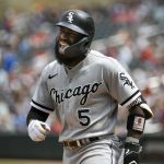 
              Chicago White Sox second baseman Josh Harrison shouts as he heads to the dugout after hitting a three-run home run against the Minnesota Twins during the seventh inning of a baseball game, Sunday, July 17, 2022, in Minneapolis. (AP Photo/Craig Lassig)
            