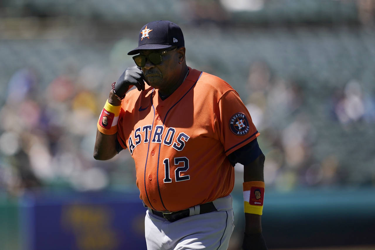 Houston Astros manager Dusty Baker Jr. walks toward the dugout after making a pitching change durin...
