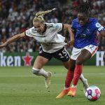 
              Germany's Giulia Gwinn, left, duels for the ball with France's Melvine Malard during the Women Euro 2022 semi final soccer match between Germany and France at MK stadium in Milton Keynes, England, Wednesday, July 27, 2022. (AP Photo/Rui Vieira)
            