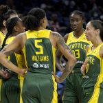
              Seattle Storm's Sue Bird, right, talks with her teammates during a break in the first half of their WNBA basketball game against the Chicago Sky Wednesday, July 20, 2022, in Chicago. (AP Photo/Charles Rex Arbogast)
            