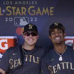 
              Seattle Mariners' Ty France and Julio Rodriguez pose for a photo in the dugout during the MLB All-Star baseball game, Tuesday, July 19, 2022, in Los Angeles. (AP Photo/Abbie Parr)
            