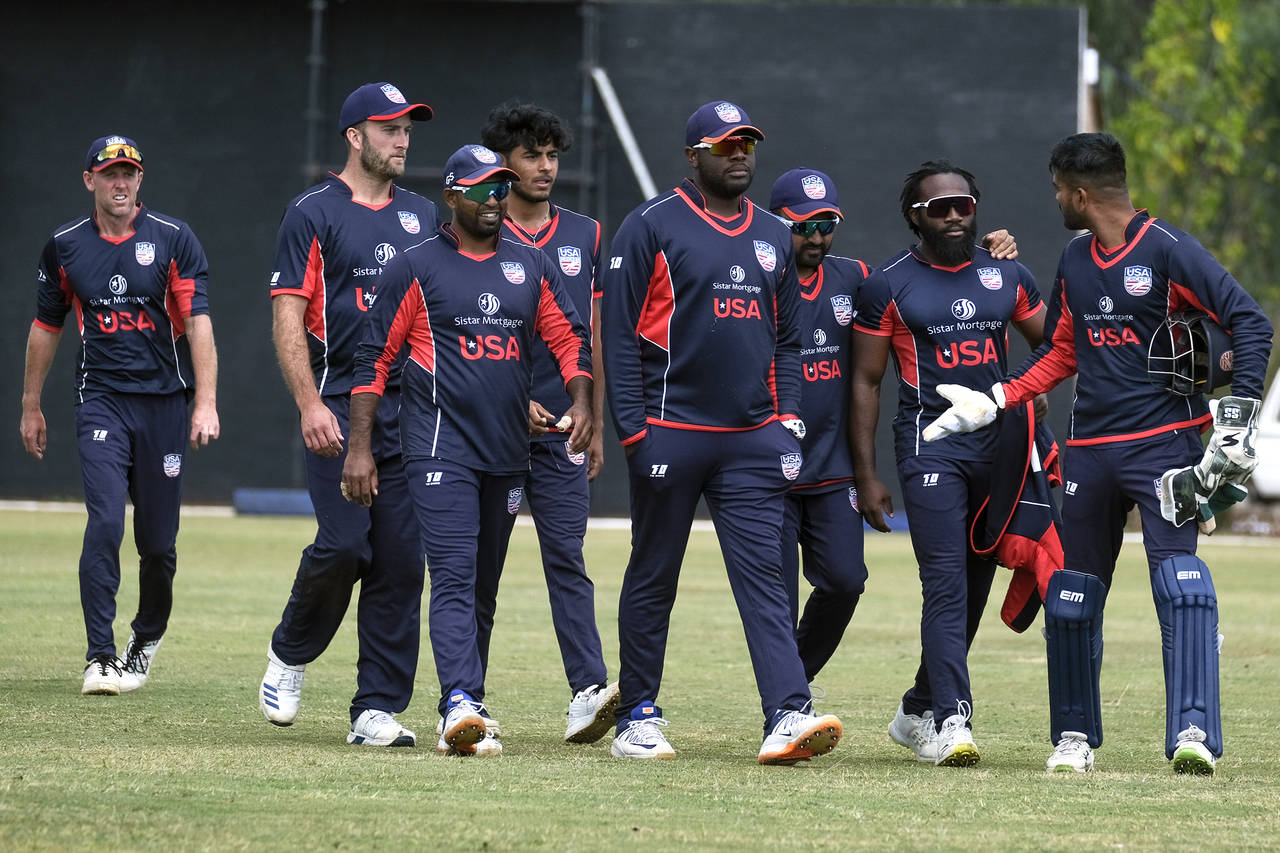 United States cricket players walk off the pitch after beating Singapore by 132 runs in a cricket W...