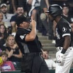 
              Home plate umpire Nick Mahrley reacts after Chicago White Sox's Tim Anderson made contact with Mahrley during the seventh inning of the team's baseball game against the Oakland Athletics on Friday, July 29, 2022, in Chicago. (AP Photo/Charles Rex Arbogast)
            