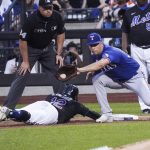 
              New York Mets' Francisco Lindor gets back to first base safely on a pickoff throw to Texas Rangers' Nathaniel Lowe during fourth inning of a baseball game, Friday, July 1, 2022, in New York. (AP Photo/Bebeto Matthews)
            