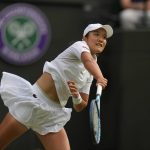
              France's Harmony Tan serves to Amanda Anisimova of the US in a women's fourth round singles match on day eight of the Wimbledon tennis championships in London, Monday, July 4, 2022. (AP Photo/Alastair Grant)
            