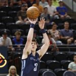 
              Memphis Grizzlies forward Jake LaRavia shoots a 3-pointer against the Philadelphia 76ers during the first quarter of an NBA summer league basketball game Tuesday, July 5, 2022, in Salt Lake City. (AP Photo/Jeff Swinger)
            