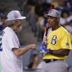 
              Actor Bryan Cranston, left, talks to former Texas Rangers player Adrian Beltre during the MLB All Star Celebrity Softball game, Saturday, July 16, 2022, in Los Angeles. (AP Photo/Mark J. Terrill)
            