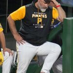
              Pittsburgh Pirates manager Derek Shelton stands on the dugout steps during the eighth inning of the team's baseball game against the Milwaukee Brewers in Pittsburgh, Friday, July 1, 2022. The Brewers won 19-2. (AP Photo/Gene J. Puskar)
            
