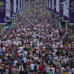 
              Supporters pack Wembley Way as they arrive for the final of the Women's Euro 2022 soccer match between England and Germany at Wembley stadium in London, Sunday, July 31, 2022. (AP Photo/Daniel Cole)
            