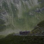 
              FILE - The pack with Denmark's Jonas Vingegaard, wearing the overall leader's yellow jersey, and Belgium's Wout Van Aert, wearing the best sprinter's green jersey, and his teammates set the pace for the pack as they climb Col du Galibier pass during the twelfth stage of the Tour de France cycling race over 165.5 kilometers (102.8 miles) with start in Briancon and finish in Alpe d'Huez, France, Thursday, July 14, 2022. (AP Photo/Daniel Cole, File)
            