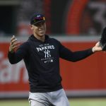 
              New York Yankees center fielder Aaron Judge gestures on the field before a baseball game against the Baltimore Orioles, Friday, July 22, 2022, in Baltimore. (AP Photo/Nick Wass)
            