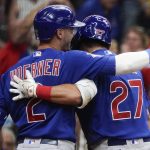 
              Chicago Cubs' Seiya Suzuki is congratulated by Nico Hoerner after hitting an inside-the-park home run during the ninth inning of a baseball game against the Milwaukee Brewers Monday, July 4, 2022, in Milwaukee. (AP Photo/Morry Gash)
            