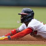 
              Atlanta Braves' Ronald Acuna Jr.  (13) steals second base in the third inning of a baseball game against the New York Mets, Wednesday, July 13, 2022, in Atlanta. (AP Photo/John Bazemore)
            