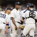 
              New York Yankees' Luis Severino huddles with teammates during the first inning of the team's baseball game against the Cincinnati Reds on Wednesday, July 13, 2022, in New York. (AP Photo/Frank Franklin II)
            
