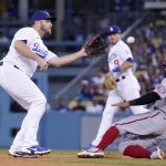
              Washington Nationals' Cesar Hernandez, right, steals second as Los Angeles Dodgers third baseman Max Muncy takes a late throw from home during the fourth inning of a baseball game Monday, July 25, 2022, in Los Angeles. (AP Photo/Mark J. Terrill)
            