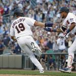 
              Minnesota Twins' Alex Kirilloff scores the winning run and celebrates with Luis Arraez the win over the Baltimore Orioles in the ninth inning of a baseball game Saturday, July 2, 2022, in Minneapolis. The Twins won 4-3. (AP Photo/Bruce Kluckhohn)
            