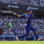 
              Los Angeles Dodgers' Trea Turner, right, hits a solo home run as San Francisco Giants catcher Joey Bart watches during the third inning of a baseball game Saturday, July 23, 2022, in Los Angeles. (AP Photo/Mark J. Terrill)
            