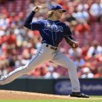 
              Tampa Bay Rays' Shane Baz throws during the first inning of a baseball game against the Cincinnati Reds in Cincinnati, Sunday, July 10, 2022. (AP Photo/Aaron Doster)
            