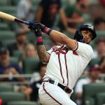 
              Atlanta Braves' Eddie Rosario hits a single during the third inning of a baseball game against the St. Louis Cardinals Monday, July 4, 2022, in Atlanta. (AP Photo/Butch Dill)
            