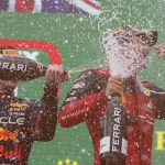 
              Ferrari driver Charles Leclerc, right, of Monaco, celebrates on the podium with second placed Red Bull driver Max Verstappen, of the Netherlands, after winning the Austrian F1 Grand Prix at the Red Bull Ring racetrack in Spielberg, Austria, Sunday, July 10, 2022. (AP Photo/Matthias Schrader)
            