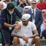 
              Australia's Nick Kyrgios receives treatment during a medical timeout as he plays Brandon Nakashima of the US in a men's singles fourth round match on day eight of the Wimbledon tennis championships in London, Monday, July 4, 2022. (AP Photo/Alberto Pezzali)
            