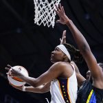 
              Indiana Fever forward NaLyssa Smith (1) shoots in front of Dallas Wings center Teaira McCowan (7) in the first half of a WNBA basketball game in Indianapolis, Sunday, July 24, 2022. (AP Photo/Michael Conroy)
            
